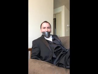 View Handcuffed and Tapegagged in a Tuxedo