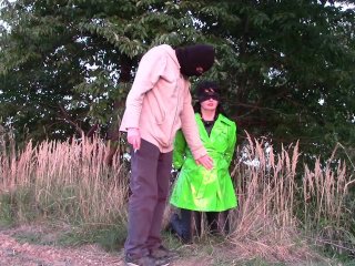 View Handcuffed in green shiny raincoat